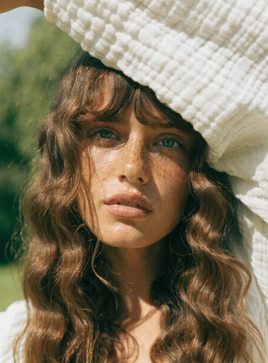 Natural beauty portrait with a skincare product, AI product photography by ENLY